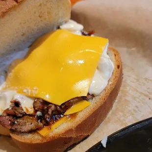 Pretty pathetic looking. Unmelted cheap American cheese on the top and bottom.  2/5 sandwich. 1/5 coleslaw.