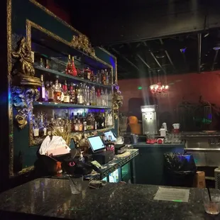 a bar with a laptop on the counter