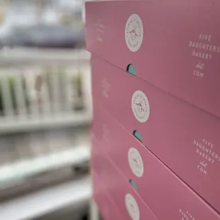 pink boxes stacked on top of each other