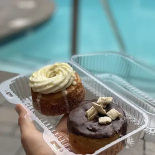 two pastries in a plastic container