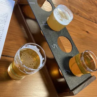 four glasses of beer on a table