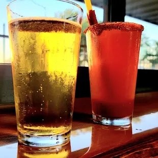 two glasses of beer on a table