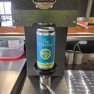 a can of beer on a machine