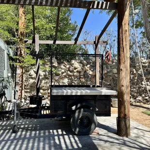 a truck parked under a pergol roof