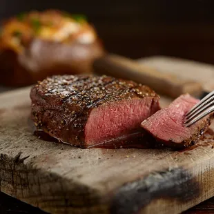 a steak on a cutting board