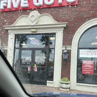 the front of a five guys store