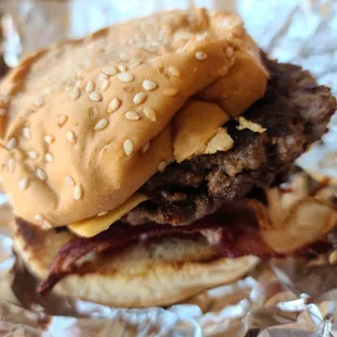 a hamburger with cheese and bacon