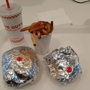 This is $25 worth of food at Five Guys...pretty hilarious and SAD. Regular cheeseburger, little bacon cheeseburger, reg fries, and drink.