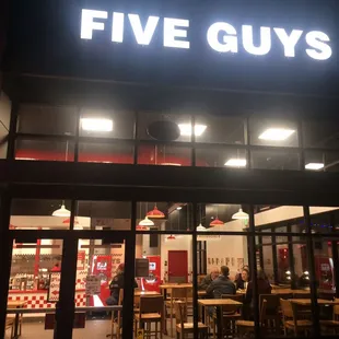 the front of a five guys restaurant