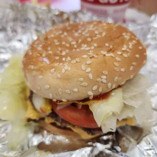 a hamburger with lettuce and tomato