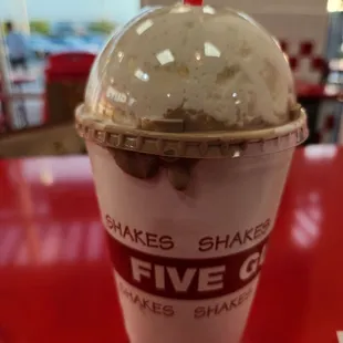 a cup of ice cream with a straw