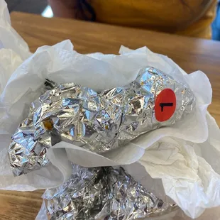 a wrapper wrapped in aluminum foil