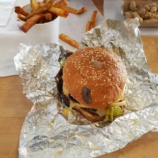 Burger and fries. Free peanuts in the background.