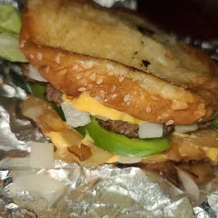 Grilled cheese with patty, lettuce, grilled onions, onions, &amp; green peppers!