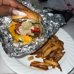 Cajun fries good and burger with mayo, grilled peppers, grilled onions, bacon , and cheese lettuce was so good