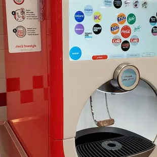 a red vending machine with stickers on it