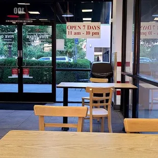 empty tables and chairs in a restaurant