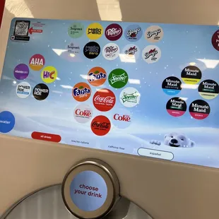 a soda machine with a lot of stickers on it
