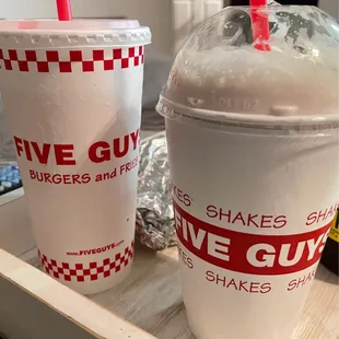 two cups of milkshakes on a tray