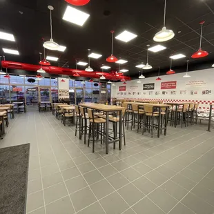 a fast food restaurant with tables and chairs