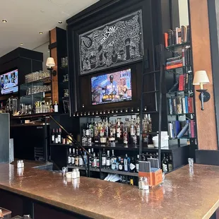 a bar with a large television