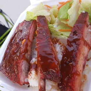 a person holding a container of food