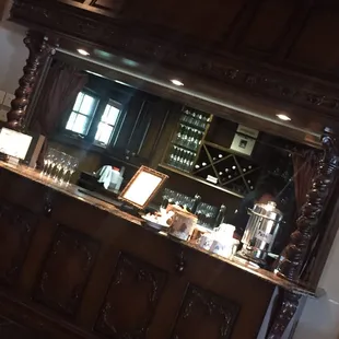 The beautiful carved wood bar