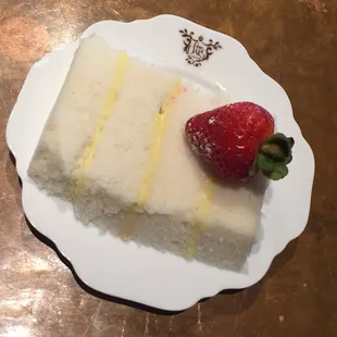 An underwhelming wedding cake on fancy custom China