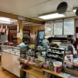 a woman working behind the counter