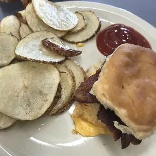 Bacon, egg, and cheese biscuit with home fries.