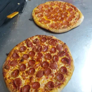 three pepperoni pizzas