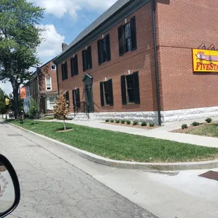 a brick building on the corner of a street