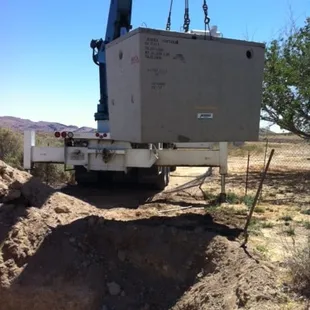 a crane lifting a piece of equipment
