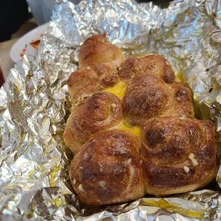 a hot dog wrapped in foil