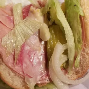 a sandwich on a paper plate