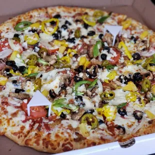 EVERYTHING Pizza. Similar to a Supreme pizza + Ham, Bacon, Pineapple, Jalapenos, Banana Peppers. ** pretty good **