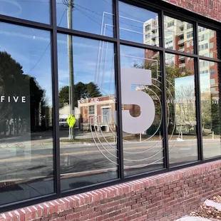 the reflection of a building in a window