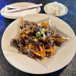 Crispy Sesame Beef with white rice.