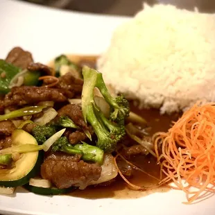 a plate of food with rice and vegetables