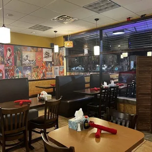 a restaurant with tables and booths