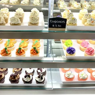 a display case of cupcakes