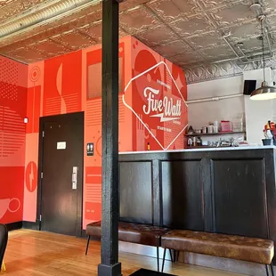 a bar with a bench in front of it