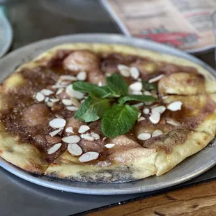 Blackberry Bomb dessert pizza  Olive Oil Base, Ricotta cheese,Blackberry Jam, Fresh mint, Honey and sliced almonds!!!