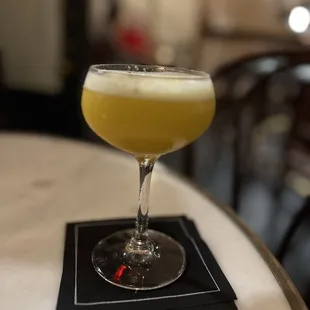 a cocktail in a glass on a table