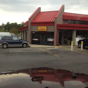 a car parked in front of the store