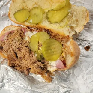 there she is. Pulled pork ham pickles swiss cheese and mustard is definitely a Cuban. For a place like this you wouldn't expect it