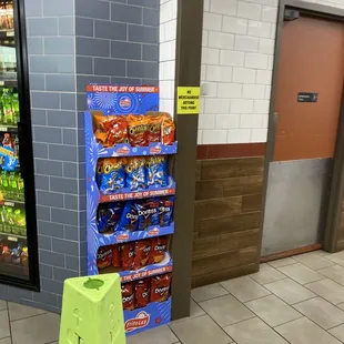 a sign in front of a vending machine