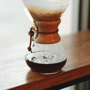 a coffee driper on a wooden table