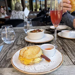 a plate of food and a glass of wine