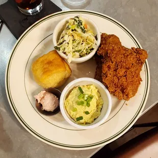 Fried chicken, potato salad, biscuit, slaw